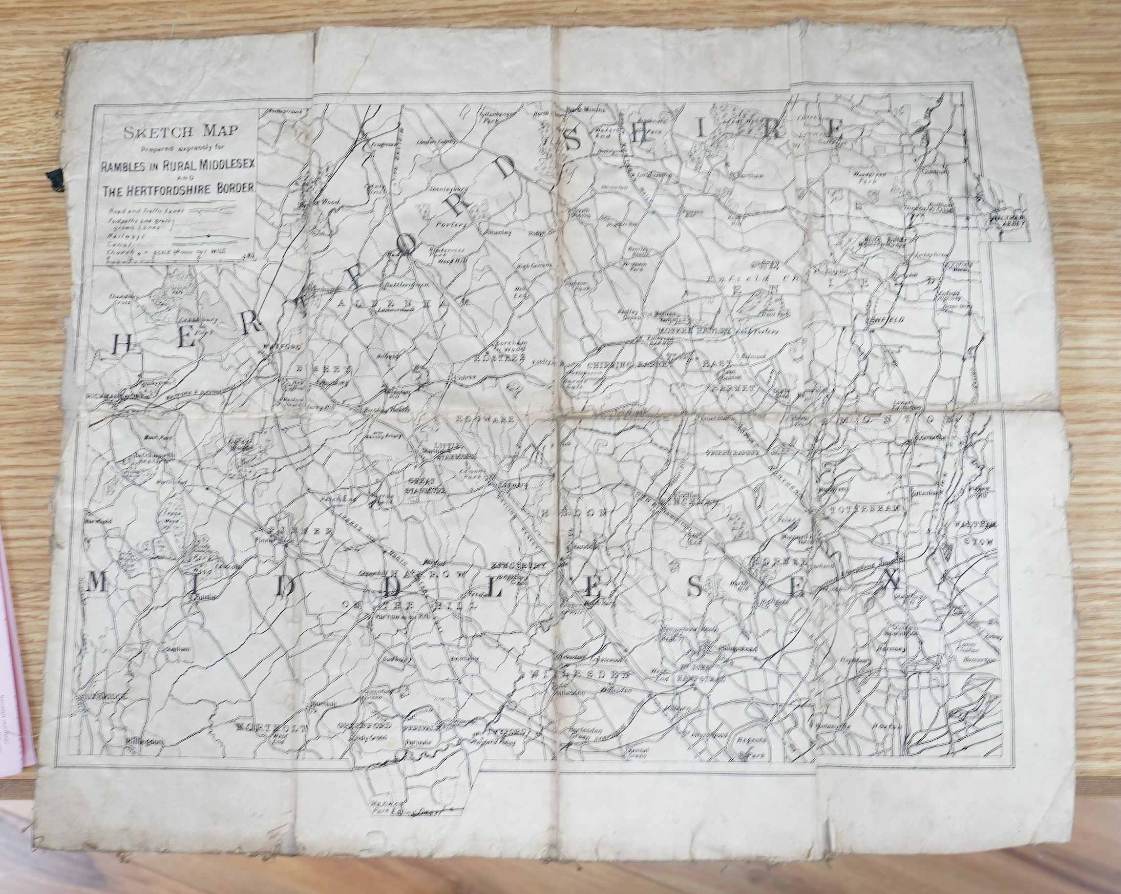 Three maps comprising: After John Senex, A New Map of London, 1720, published by Cassell, Petter & Galpin, linen backed folding map, with slipcase, London in the Reign of Queen Elizabeth, published by Cassell, linen back